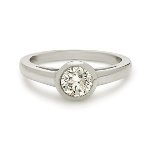 14K white gold bezal set cartier style solitaire engagement ring.