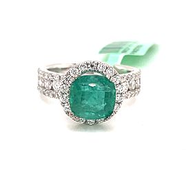 Cushion-Cut Emerald and Halo diamonds channel set shank Ring in 18K White Gold